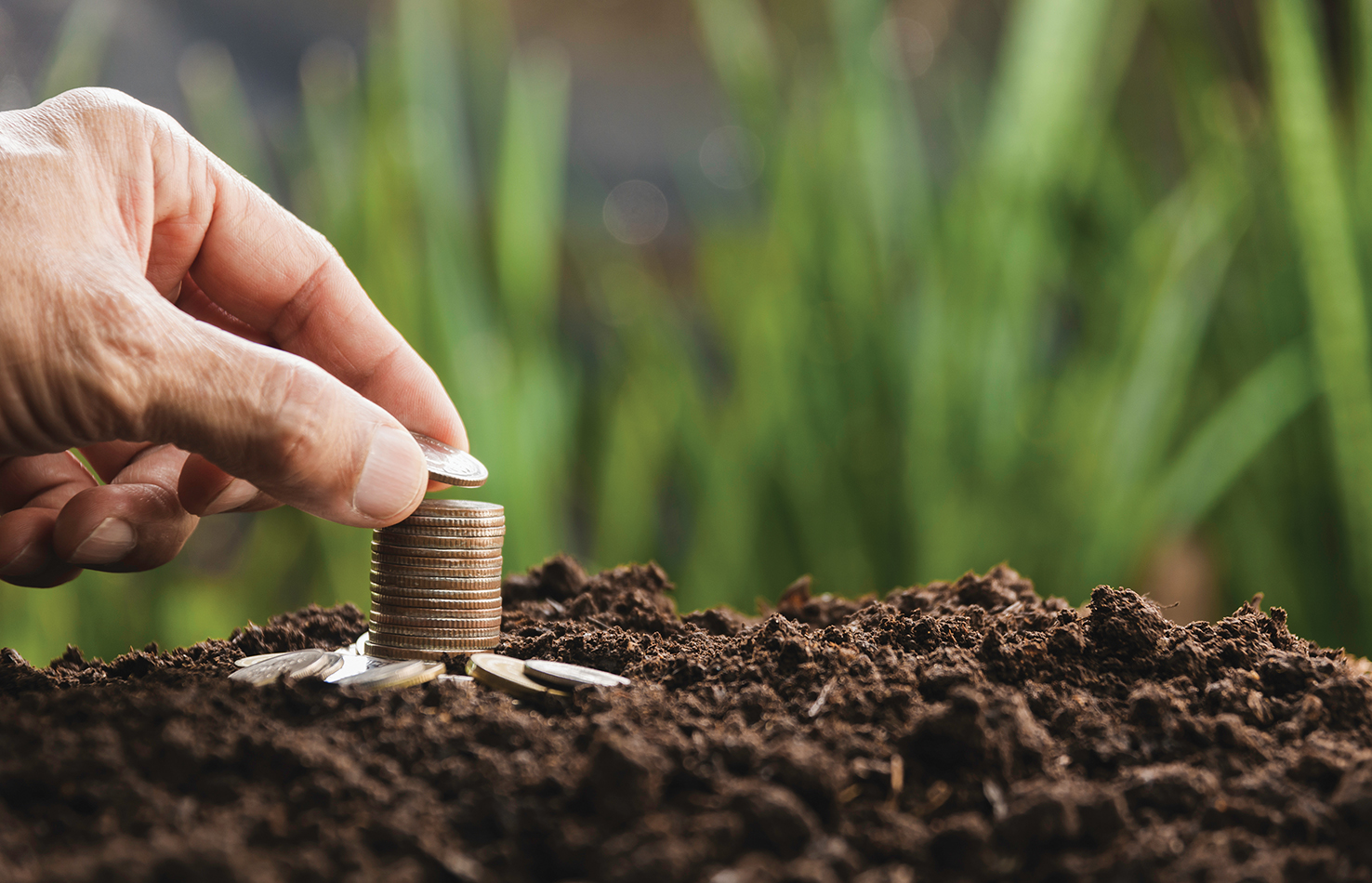 Hand with money coins stack, Business investment growth concept, saving concept, Hand putting stack of coin.